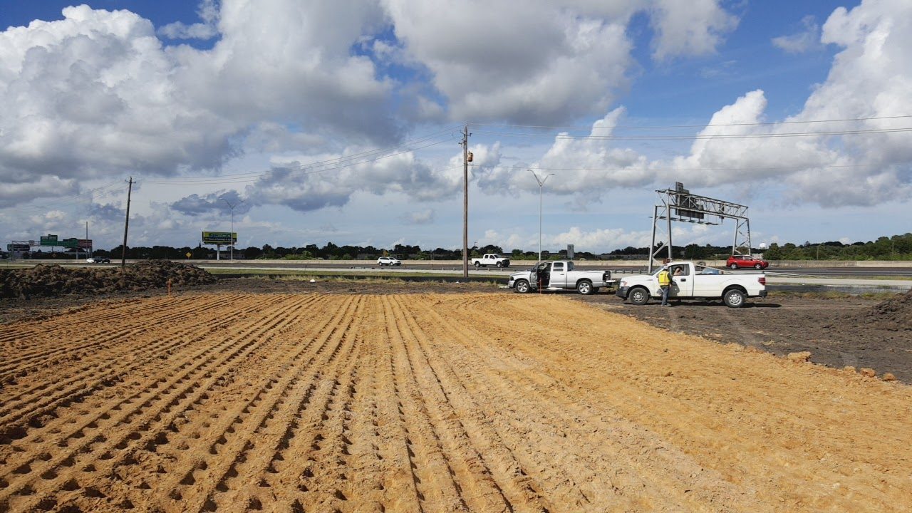 GMS CAT D4K LGP bulldozer with operator on commercial pad preparation in Greater Houston